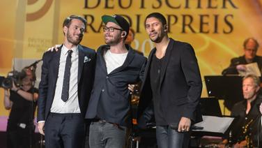 Johannes Strate von Revolverheld, Mark Forster und Andreas Bourani bei der Radiopreis-Gala. © Deutscher Radiopreis/ Benjamin Hüllenkremer Foto: Benjamin Hüllenkremer